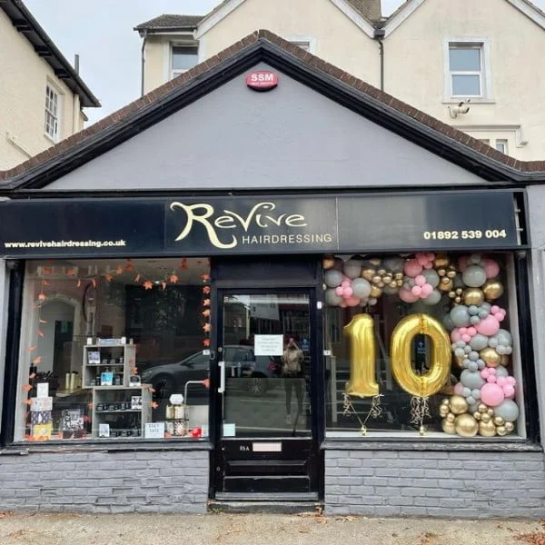Balloons by 47 hair salon window