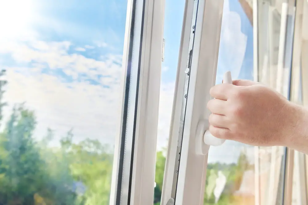 man removing house window