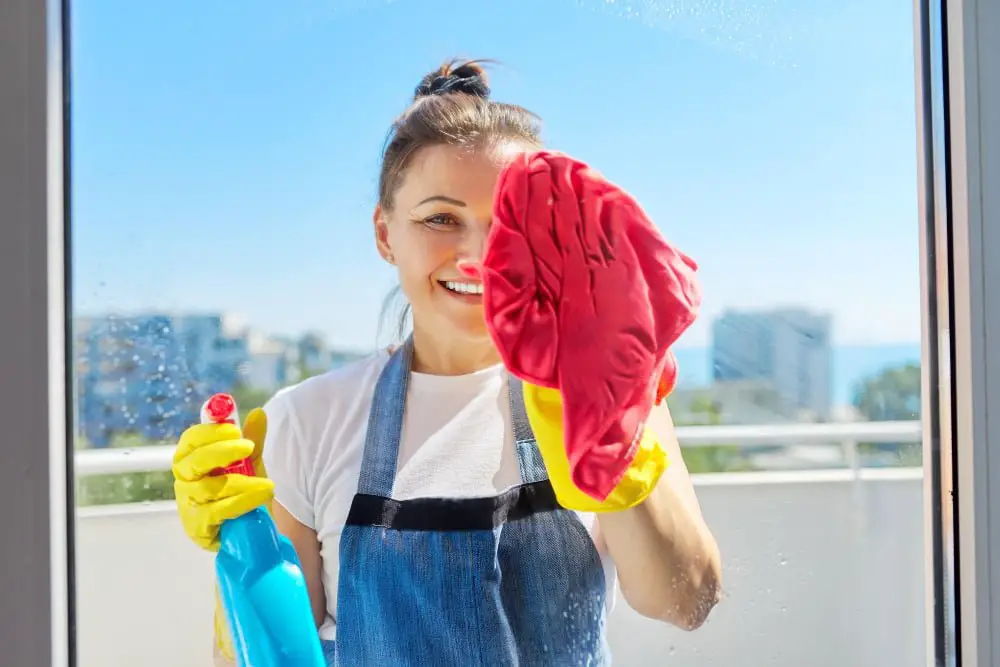 woman cleaning window