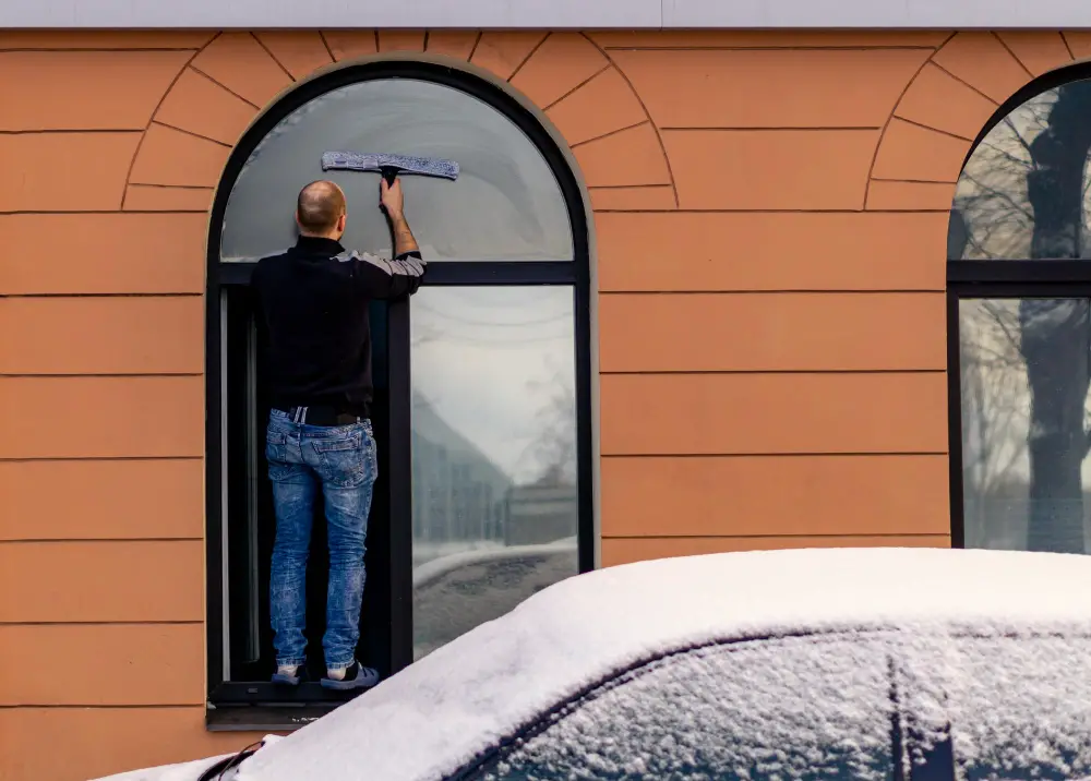 snow outside house window cleaning