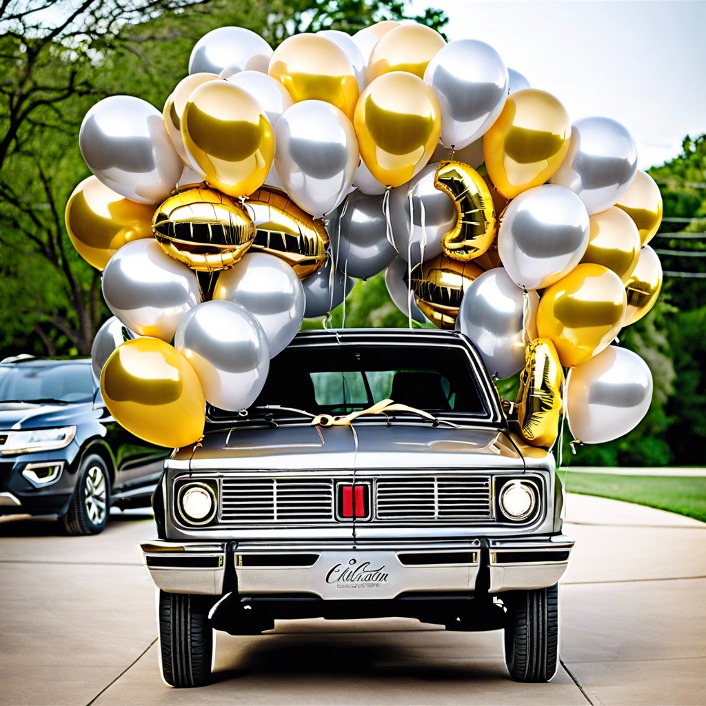 silver and gold graduation balloons tied to the car
